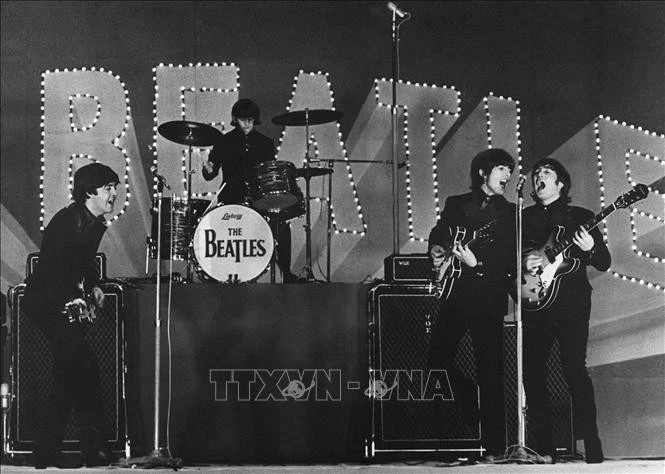 Các thành viên ban nhạc The Beatles biểu diễn tại Tokyo, Nhật Bản năm 1966. Ảnh tư liệu: AFP/TTXVN