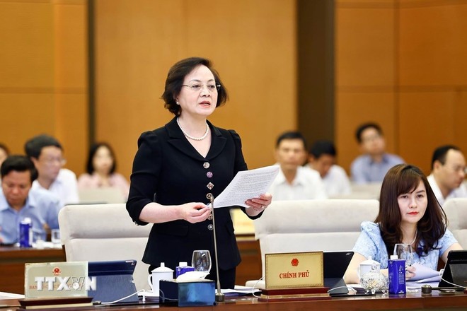 Bộ trưởng Bộ Nội vụ Phạm Thị Thanh Trà trình bày tóm tắt tờ trình chung. (Ảnh: Doãn Tấn/TTXVN) Bộ trưởng Bộ Nội vụ Phạm Thị Thanh Trà trình bày tóm tắt tờ trình chung. (Ảnh: Doãn Tấn/TTXVN)