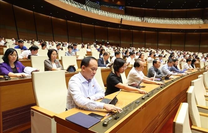 Quốc hội biểu quyết thông qua Nghị quyết của Quốc hội về thí điểm về một số cơ chế, chính sách đặc thù phát triển nhà ở xã hội. Ảnh: Văn Điệp/TTXVN