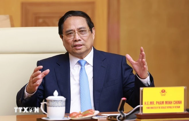 Thủ tướng Phạm Minh Chính làm việc với Đoàn Hội đồng kinh doanh Hoa Kỳ-ASEAN. (Ảnh: Dương Giang/TTXVN)