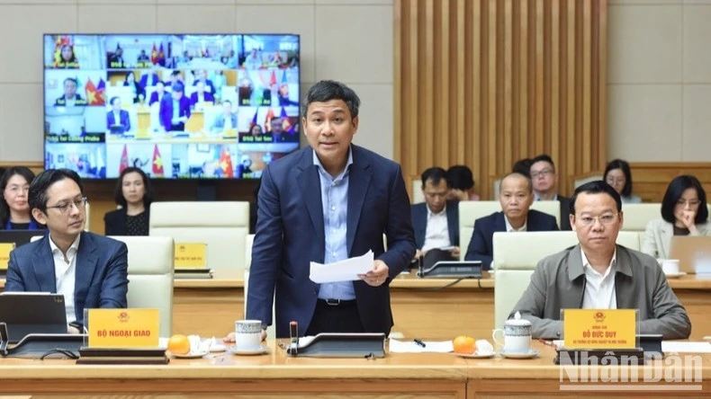 Thứ trưởng Thường trực Ngoại giao Nguyễn Minh Vũ phát biểu ý kiến (Ảnh: TRẦN HẢI).