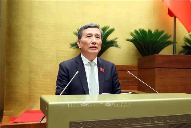 Chủ nhiệm Ủy ban Khoa học, Công nghệ và Môi trường của Quốc hội Lê Quang Huy trình bày Báo cáo thẩm tra dự án Luật sửa đổi, bổ sung một số điều của Luật Chất lượng sản phẩm, hàng hóa. Ảnh: Phạm Kiên/TTXVN