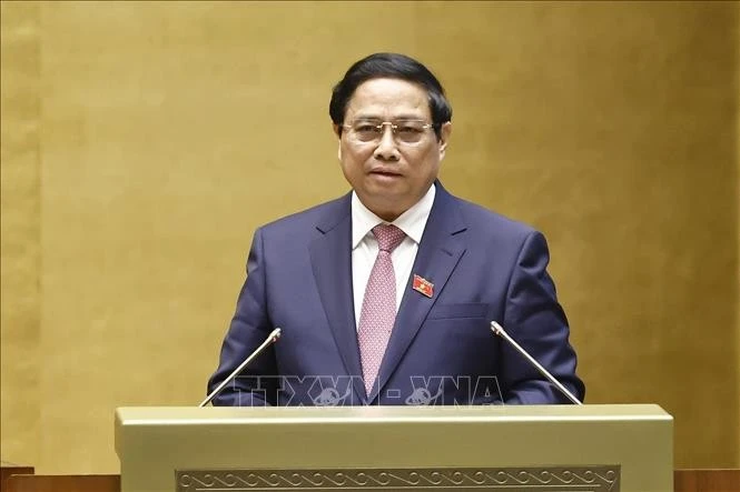 Thủ tướng Phạm Minh Chính trình bày Báo cáo kết quả thực hiện kế hoạch phát triển kinh tế - xã hội năm 2024, dự kiến kế hoạch phát triển kinh tế - xã hội năm 2025. Ảnh: Doãn Tấn/TTXVN