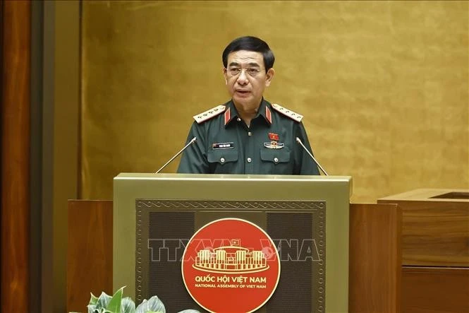 Bộ trưởng Bộ Quốc phòng Phan Văn Giang trình bày Tờ trình dự án các luật liên quan đến quốc phòng-an ninh. Ảnh: Doãn Tấn/TTXVN