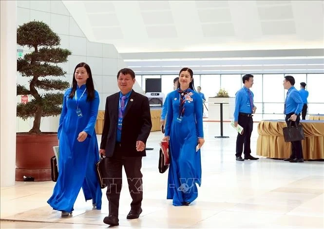 Các đại biểu đến dự Phiên làm việc trọng thể Đại hội XIV Công đoàn Việt Nam.