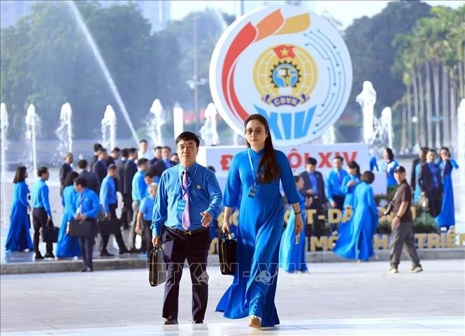 Các đại biểu đến dự Phiên làm việc trọng thể Đại hội XIV Công đoàn Việt Nam.