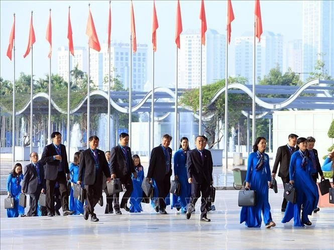 Các đại biểu đến dự Phiên làm việc trọng thể Đại hội XIV Công đoàn Việt Nam.