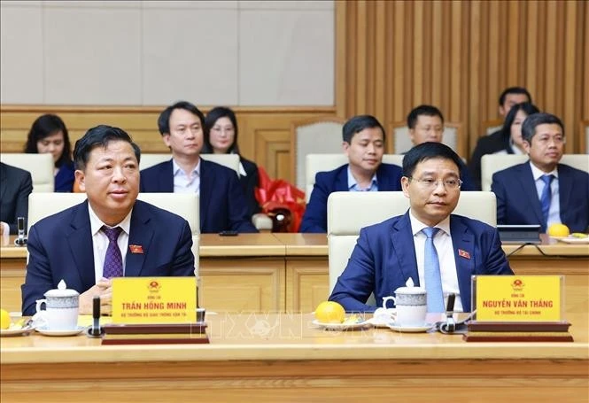Đồng chí Nguyễn Văn Thắng, Bộ trưởng Bộ Tài chính và đồng chí Trần Hồng Minh Bộ trưởng Bộ Giao thông vận tải.