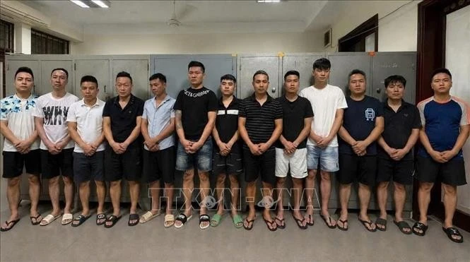Các đối tượng tượng bị bắt. Ảnh: TTXVN phát