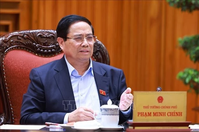 Thủ tướng Phạm Minh Chính chủ trì cuộc họp về tình hình triển khai tuyến đường sắt trọng điểm. Ảnh: Dương Giang/TTXVN