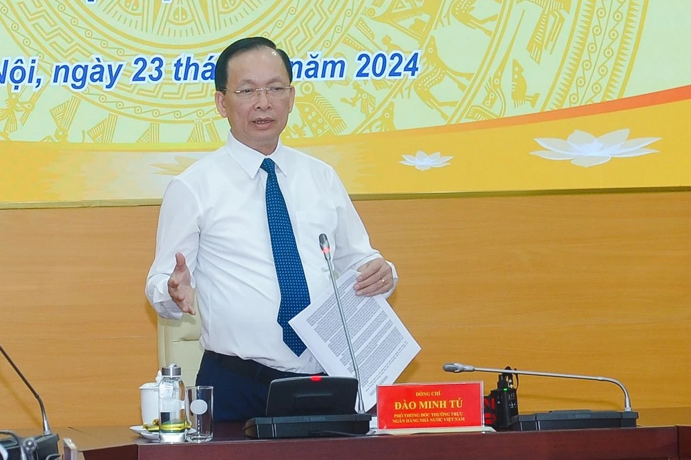 Ông Đào Minh Tú, Phó Thống đốc Ngân hàng Nhà nước phát biểu tại họp báo.