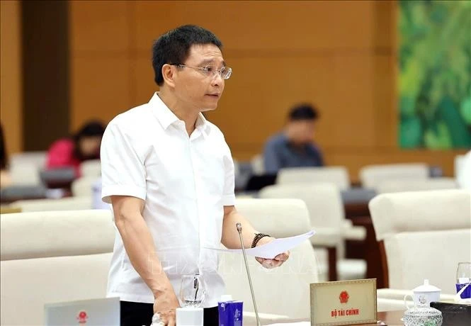 Bộ trưởng Bộ Tài chính Nguyễn Văn Thắng phát biểu tại phiên họp. Ảnh: Doãn Tấn/TTXVN