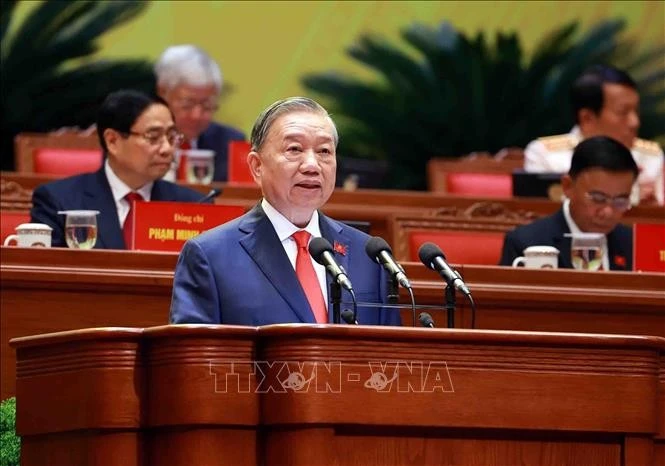 Tổng Bí thư Tô Lâm trình bày Báo cáo của Ban Chấp hành Trung ương Đảng khóa XIII về các văn kiện trình Đại hội XIV của Đảng. Ảnh: TTXVN