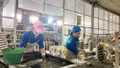 Workers of Hoang Lien Son Technical Ceramics joint Stock Company during their shift.