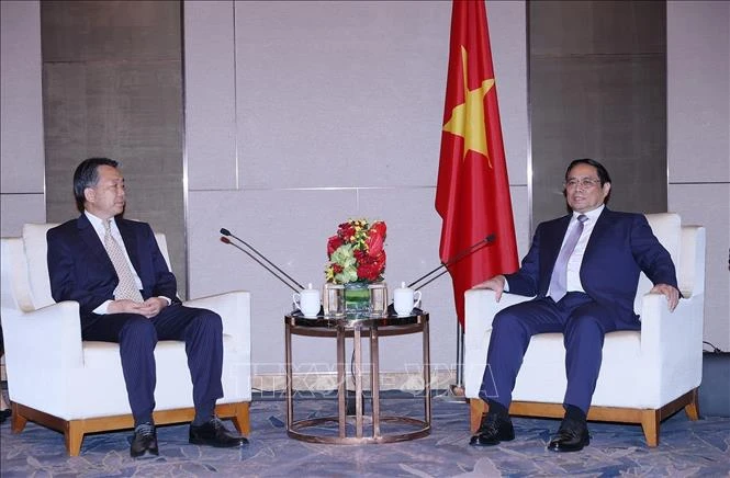 Thủ tướng Phạm Minh Chính với Phó Hội trưởng Hội hữu nghị đối ngoại nhân dân Trung Quốc Viên Mẫn Đạo.