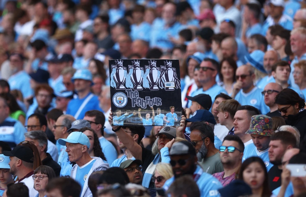 Man City đi vào lịch sử với 4 chức vô địch Ngoại hạng Anh liên tiếp. (Ảnh: Reuters)