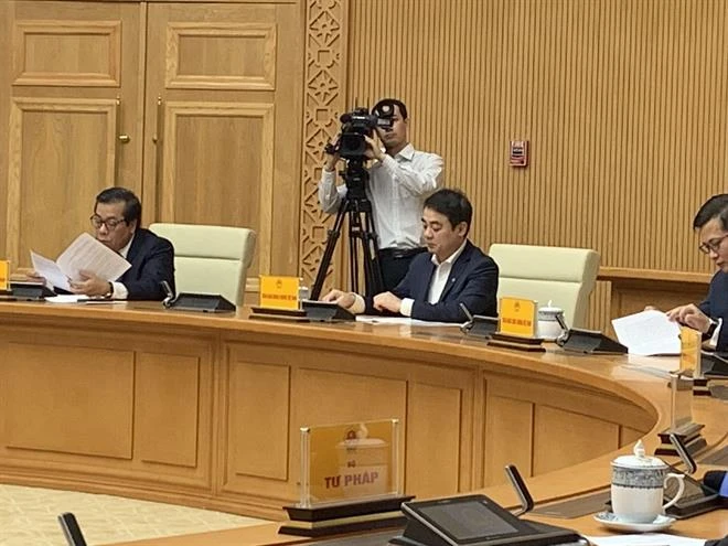 Từ trái qua phải: Phó Thống đốc NHNN Nguyễn Kim Anh và Chủ tịch HĐQT Vietcombank Nghiêm Xuân Thành dự Hội nghị.