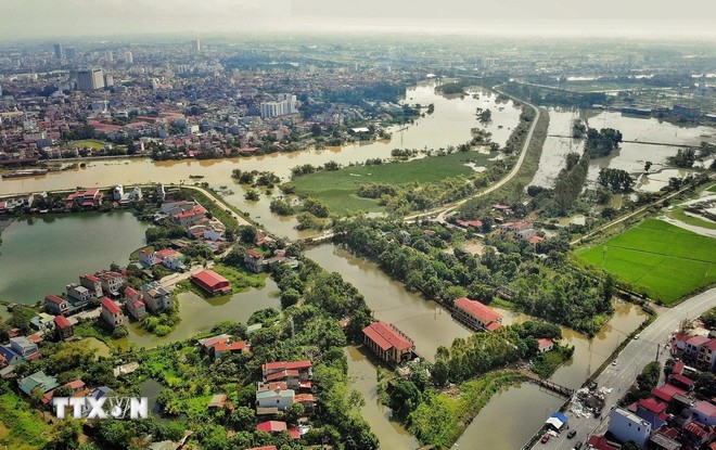 គោលដៅគឺដើម្បីឲ្យឃុំប្រមាណ ៦៥% ទូទាំងប្រទេសសម្រេចបានស្តង់ដារនៃតំបន់ជនបទថ្មី ដែលក្នុងនោះប្រហែល ១០% នៃឃុំទាំងនោះត្រូវបានទទួលស្គាល់ថាជាតំបន់ជនបទទំនើប។ (រូបថត៖ ដាញ់ ឡាំ/TTXVN) Phấn đấu cả nước có khoảng 65% số xã đạt chuẩn nông thôn mới, trong đó, có khoảng 10% số xã đạt chuẩn nông thôn được công nhận xã đạt nông thôn hiện đại. (Ảnh: Danh Lam/TTXVN)