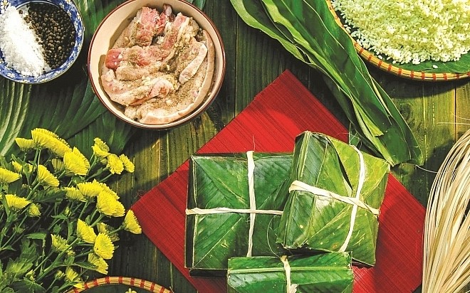 Bánh chưng thể hiện tấm lòng thơm thảo của con cháu thành tâm dâng lên trời đất, tổ tiên mỗi dịp Tết đến, Xuân về. Ảnh: Internet 1723-cach-goi-banh-chung-ngay-tet.jpg