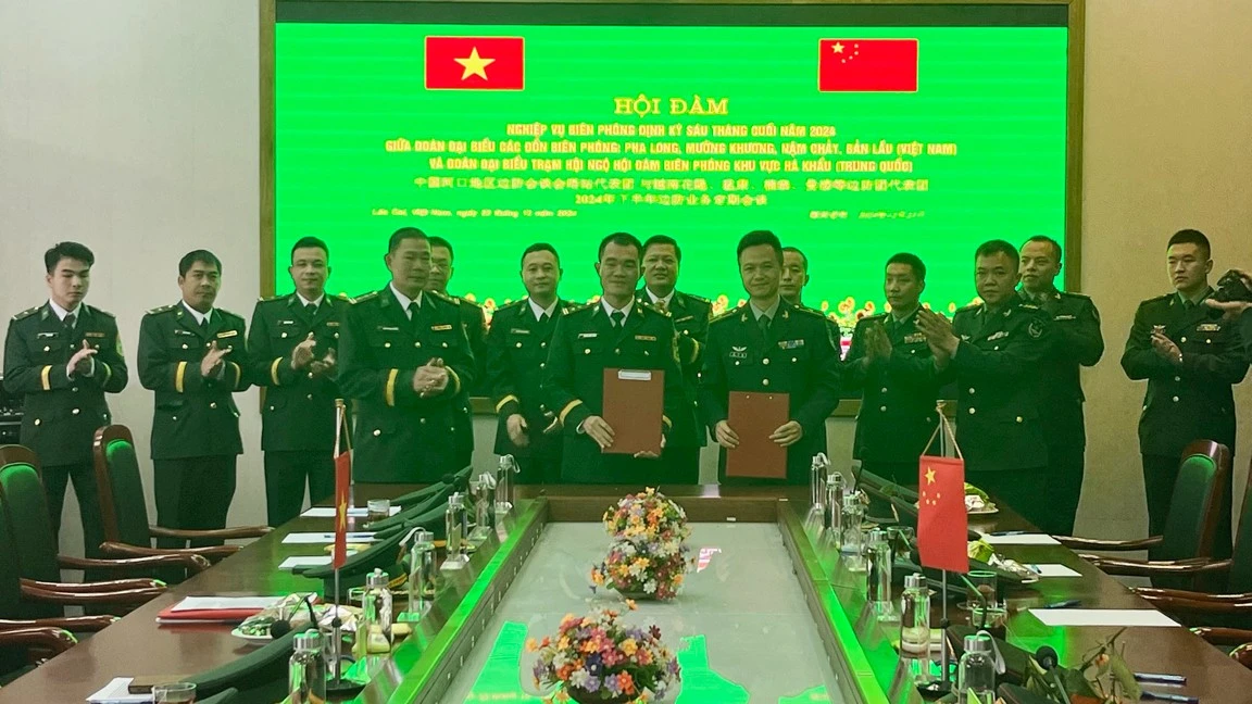 truong-doan-cua-hai-ben-ky-ket-bien-ban-hoi-dam.jpg
